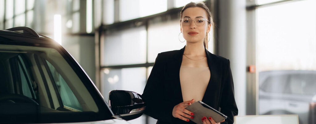 a woman in a suit holding a tablet